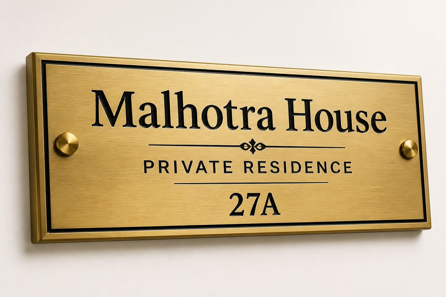 Brushed brass catalogue nameplate with dark lettering